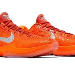 Nike Orange Athletic Shoes with Silver Accents